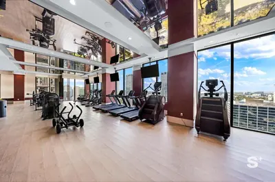 a gym with treadmills and ellipticals in a building at Luxurious & Stylish 2BD Apt in Miami Gym & Pool in Miami