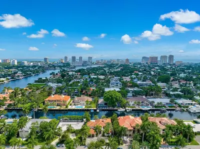an aerial view of a city with a river and buildings at WATERFRONT MANSION Las Olas in Fort Lauderdale