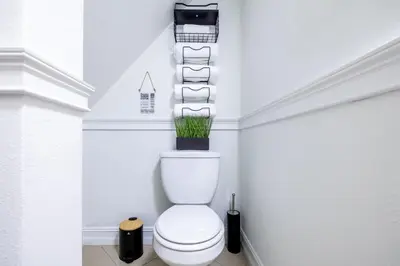 a bathroom with a toilet with a plant on top of it at West Kendall Retreat Everglades Miccosukee in Hammocks