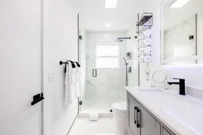 a white bathroom with a shower and a sink at West Kendall Retreat Everglades Miccosukee in Hammocks