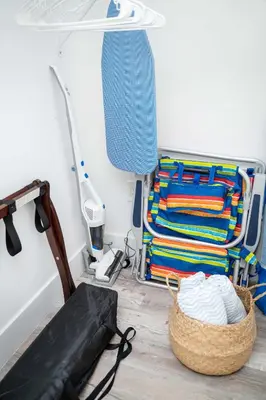 a room with a chair and a basket of towels at Mar & Luna Family retreat in Miami