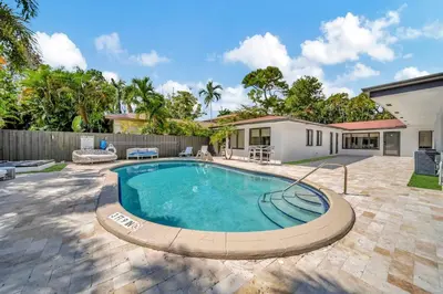a swimming pool in the backyard of a house at Waterfront Unit #3 20 Min Walk to Beach and Shops in Fort Lauderdale