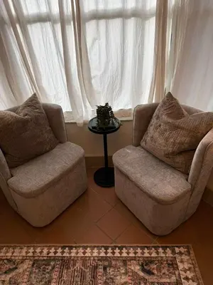 two chairs and a table in front of a window at Trio in Miami