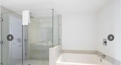 a bathroom with a tub and a glass shower at Hyde house 3507 AL MAR in Hollywood