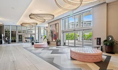a lobby with a large building with large windows at Hyde house 3507 AL MAR in Hollywood