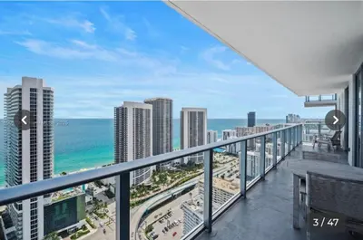 a balcony with a view of the ocean and buildings at Hyde house 3507 AL MAR in Hollywood
