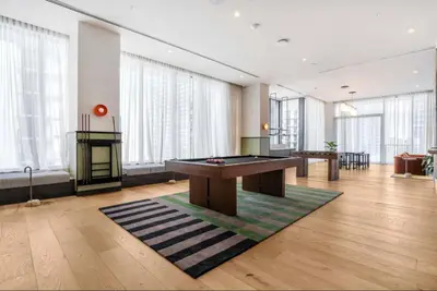 a room with a pool table and a fireplace at The Crosby Miami Worldcenter by Palermo Home Miami in Miami