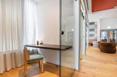 a room with a desk and a chair in a room at The Crosby Miami Worldcenter by Palermo Home Miami in Miami
