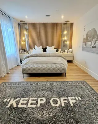 a bedroom with a bed with a keep off sign on it at Luxury Gem in Fort Lauderdale
