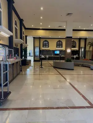 an empty lobby of a hotel with a reception at Direct Ocean View Condo,Balcony kitchen pool gym sauna valet parking direct beach access for perfect vacation in Sunny Isles Miami in Sunny Isles Beach