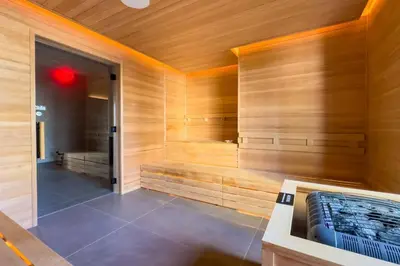 a sauna with a tub in a wooden wall at 2907 Modern Apartment in Downtown Miami with Pool and Gym in Miami