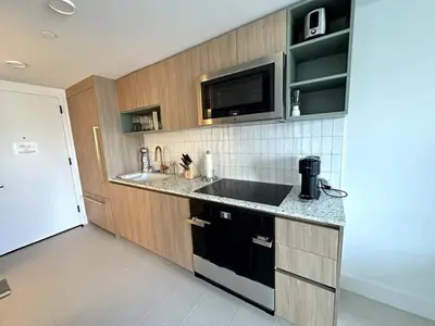 a kitchen with a sink and a microwave at 2907 Modern Apartment in Downtown Miami with Pool and Gym in Miami