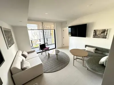 a living room with a couch and a table at 2907 Modern Apartment in Downtown Miami with Pool and Gym in Miami