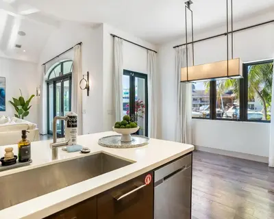 a kitchen with a sink and a large window at The Rendez-Vous Villa Waterfront in Fort Lauderdale
