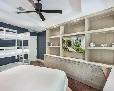 a bedroom with a bed and a ceiling fan at The Rendez-Vous Villa Waterfront in Fort Lauderdale