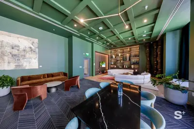 a room with green walls and a table and chairs at Cozy Ensuite 1BR Apartment in DTW Miami in Miami