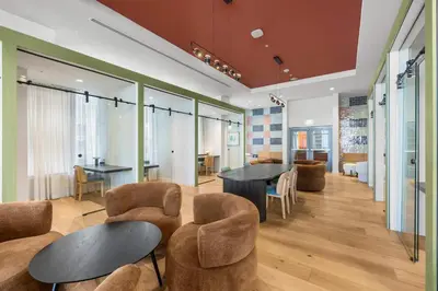 a lobby with two tables and chairs and a dining room at Central Downtown Condo with Pool & Gym in Miami
