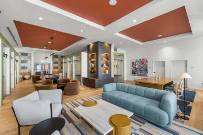 a living room with a blue couch and a table at Central Downtown Condo with Pool & Gym in Miami