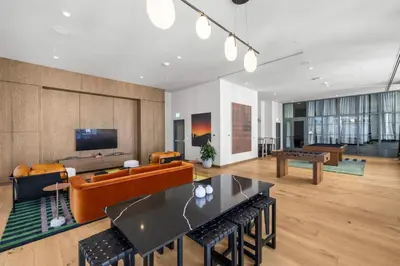 a living room with a couch and a table at Central Downtown Condo with Pool & Gym in Miami