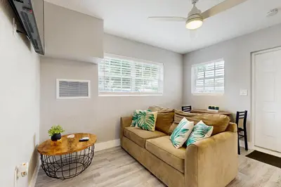 a living room with a couch and a table at The Palms A in Fort Lauderdale
