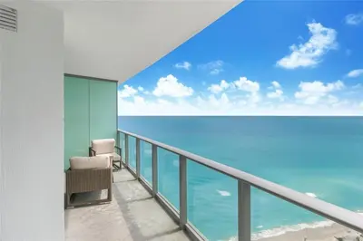 a balcony with a view of the ocean at Lux Beachfront Retreat at Hyde Resort w OceanView in Hollywood
