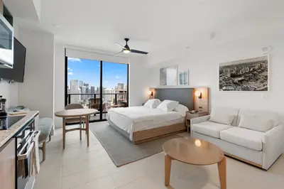 a bedroom with a bed and a living room at 3512 Elegant Studio in Miami Downtown with a Pool and a 24-7 Gym in Miami