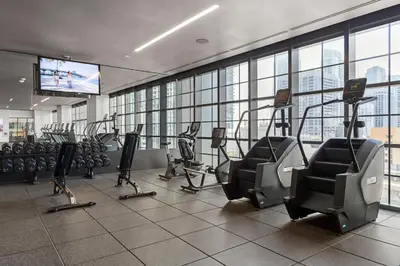 a gym with treadmills and elliptical machines at 3512 Elegant Studio in Miami Downtown with a Pool and a 24-7 Gym in Miami