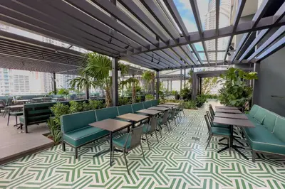 a restaurant with tables and chairs and a glass ceiling at 3512 Elegant Studio in Miami Downtown with a Pool and a 24-7 Gym in Miami