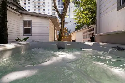 a hot tub in the backyard of a building at 7BD Downtown Oasis - Pool - 10 Mins to South Beach in Miami