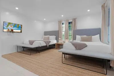 a bedroom with two beds and a couch at 7BD Downtown Oasis - Pool - 10 Mins to South Beach in Miami