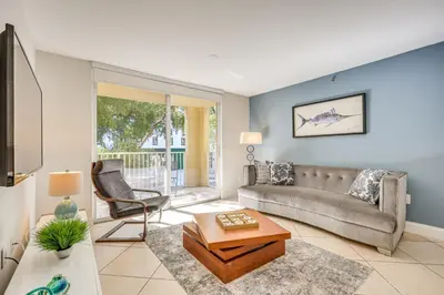 a living room with a couch and a table at Resort Condo By Aventura Mall! Gated Community in Aventura