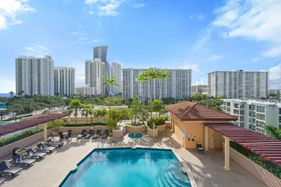 a view of the pool at the encore hotel at Spacious 3BR Condo Across from Beach with Ocean & City Views in Sunny Isles Beach
