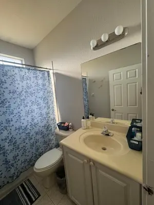 a bathroom with a sink and a toilet and a mirror at The B Shared Resident in Miramar