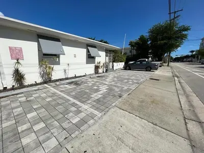 a car parked in a parking lot next to a building at Miami Studio a Few Steps to the Beach in Miami