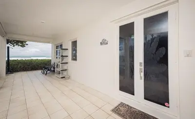 an empty house with a patio with a view of the ocean at Oceanfront Luxury Villa 5Bedroom and 4Bath Beach Access in Hollywood