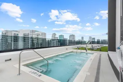 a hot tub on the roof of a building at Stylish Studio in Downtown Location in Miami