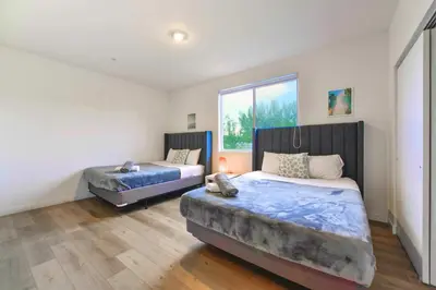 a bedroom with two beds and a window at Miami Townhouse Stay with Free Parking in Miami