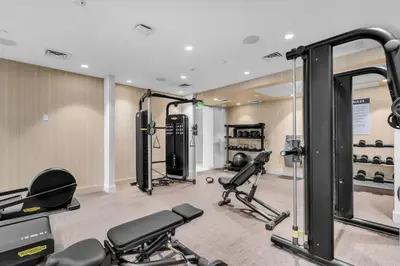 a gym with several treadmills and cardio machines at Chic OceanView 2 Bedroom with Free Parking Pool Jacuzzi in Sunny Isles Beach