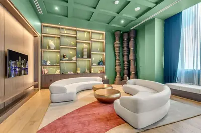a living room with two white couches and a rug at Corner Chic 2 Bedroom Downtown with Rooftop Pool & Views in Miami