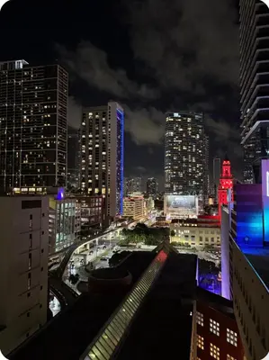 a view of a city skyline at night at Luxxe Suite Downtown Brickell in Miami