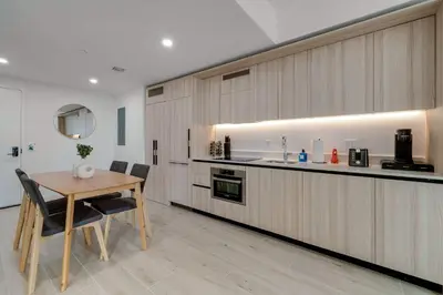 a kitchen with a table and chairs and a counter at Sleek Escape-Resort-Style Stay with Pool Spa & more in Miami