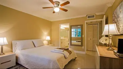 a bedroom with a bed and a ceiling fan at The Yacht Club at Aventura Miami 3405 in South Island
