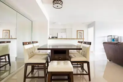 a dining room with a table and chairs at The Yacht Club at Aventura Miami 6307 in South Island