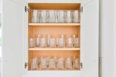 a cupboard filled with lots of empty glasses at Family Poolside Palm Retreat with Jacuzzi in Hollywood