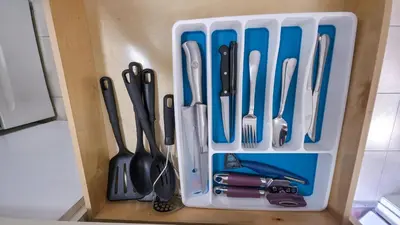 a plastic container filled with utensils in a drawer at Apartment close to shops & beach-Free Parking 109 in Hollywood