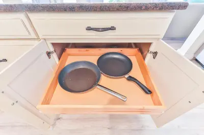 two pots and pans in a drawer in a kitchen at Heart of Hollywood Villa in Hollywood