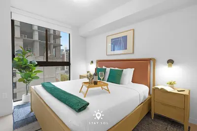 a bedroom with a large bed and a window at Stylish 1BR Apt With Pool in Miami