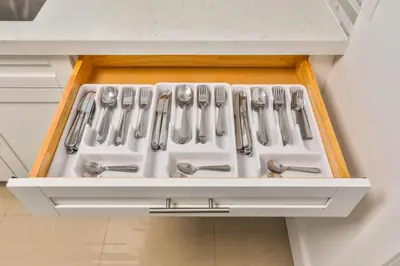a white stove in a kitchen with silver utensils at 50 Shades of Grey on the Canal Villa STR-4500 in Fort Lauderdale