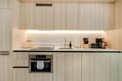 a kitchen with a sink and a stove top oven at Downtown Edit-Resort Style Stay with Full Amenities in Miami