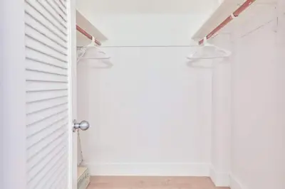 a room with a white door and a white wall at Coastal Elegance Oasis in Sunny Isles STR-01308 in Sunny Isles Beach